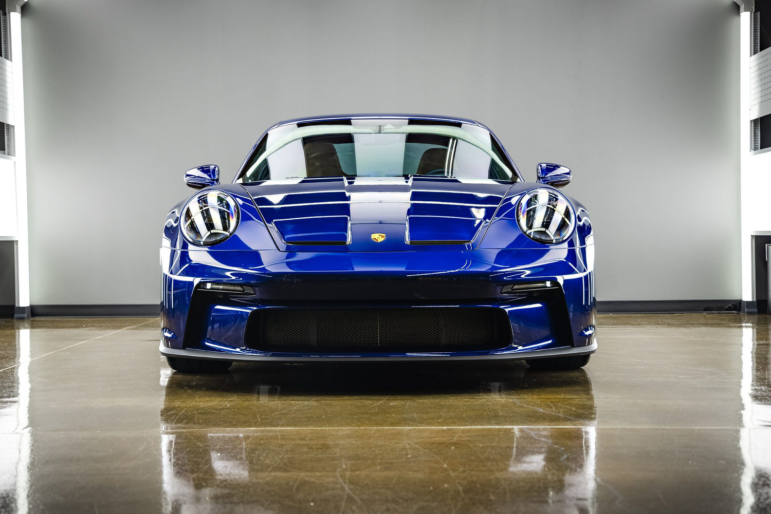 Title: Expert Car Detailing Near Me: Stunning Blue Porsche 911 GT3
Alt Text:
A vibrant blue Porsche 911 GT3, gleaming after a professional car detailing service in Sydney, New South Wales, Australia. This front-facing shot emphasizes the flawless finish achieved through meticulous detailing near me. The pristine condition of the car showcases the high-quality results one can expect from expert car detailing. If you're in Sydney and searching for top-tier detailing near me to make your sports car shine.