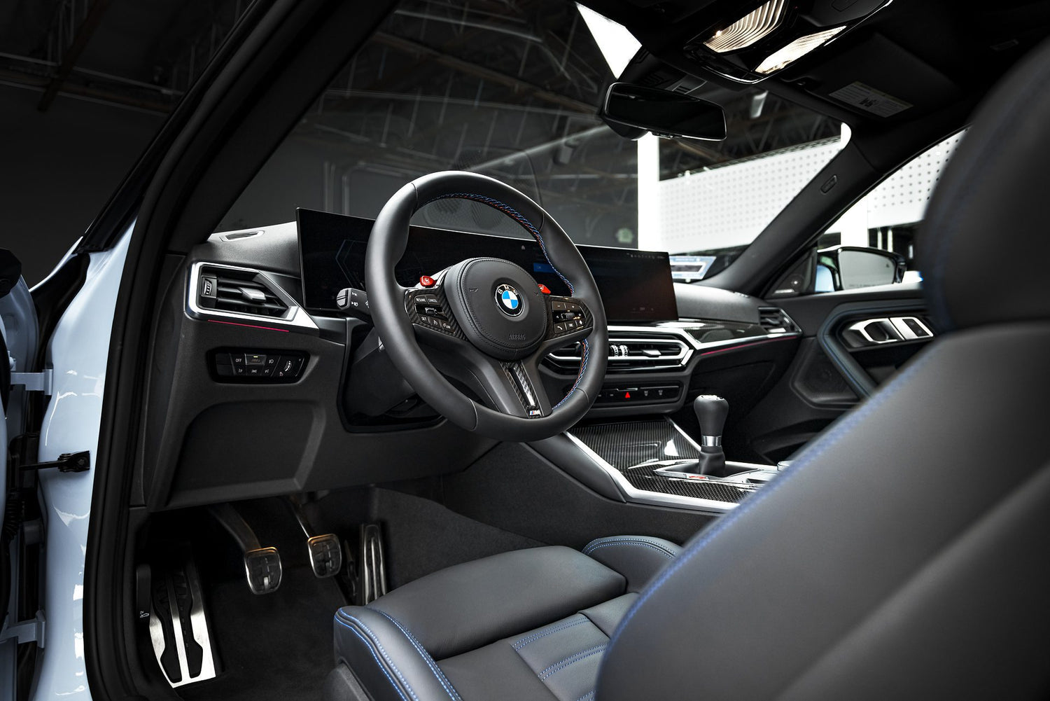 Title: Premium Interior Detail and Car Detailing Near Me: BMW M3
Alt Text:
The meticulously cleaned interior of a BMW M3, showcasing the results of a professional interior detail as part of comprehensive car detailing services near me in Sydney, New South Wales, Australia. The image highlights the clean leather seats with blue stitching, the detailed dashboard, and the pristine condition of the steering wheel and pedals. This demonstrates the level of care and attention to detail provided by our experts.